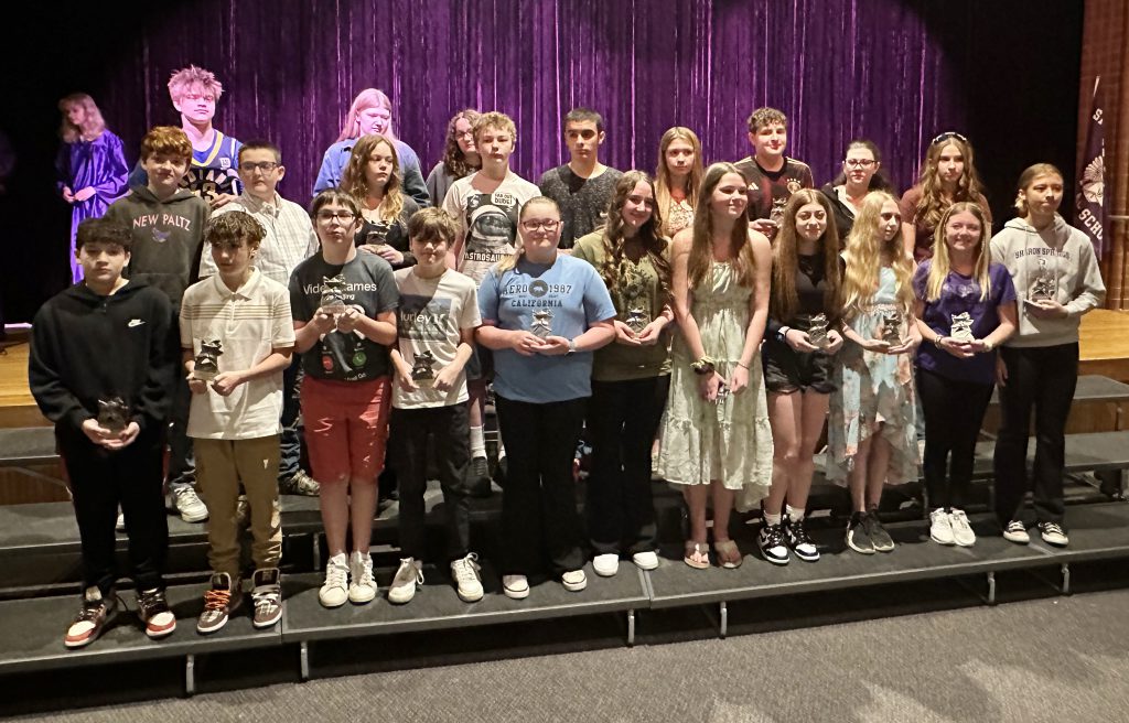 group of 25 middle school students inducted into the middle school honor society