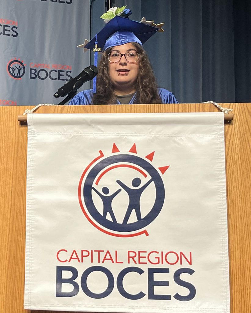 graduate speaks at the podium