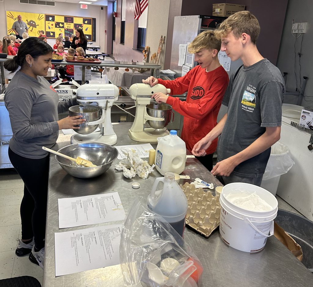 students prepare cake batter