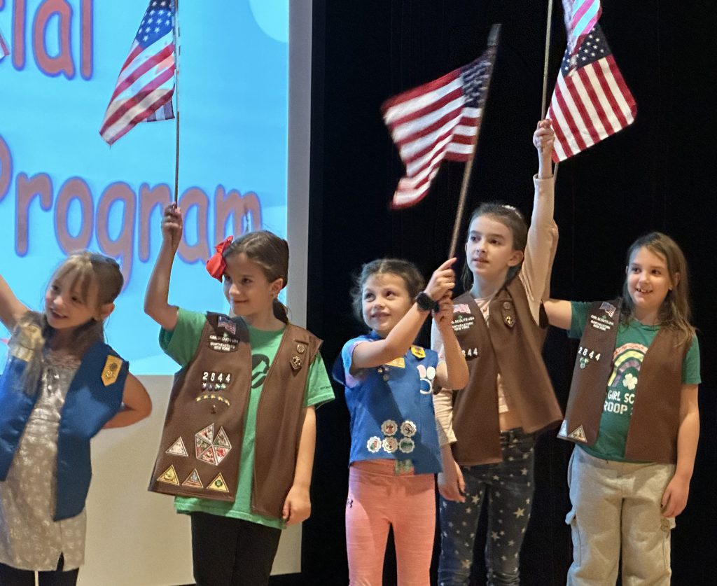 Girl Scouts patriotically celebrate our veterans at a special Morning Program