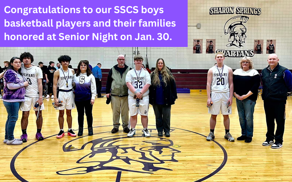 boys basketball players honors with their families at Senior Night 2025