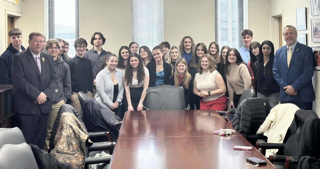 group of high school students meet with their state representatives