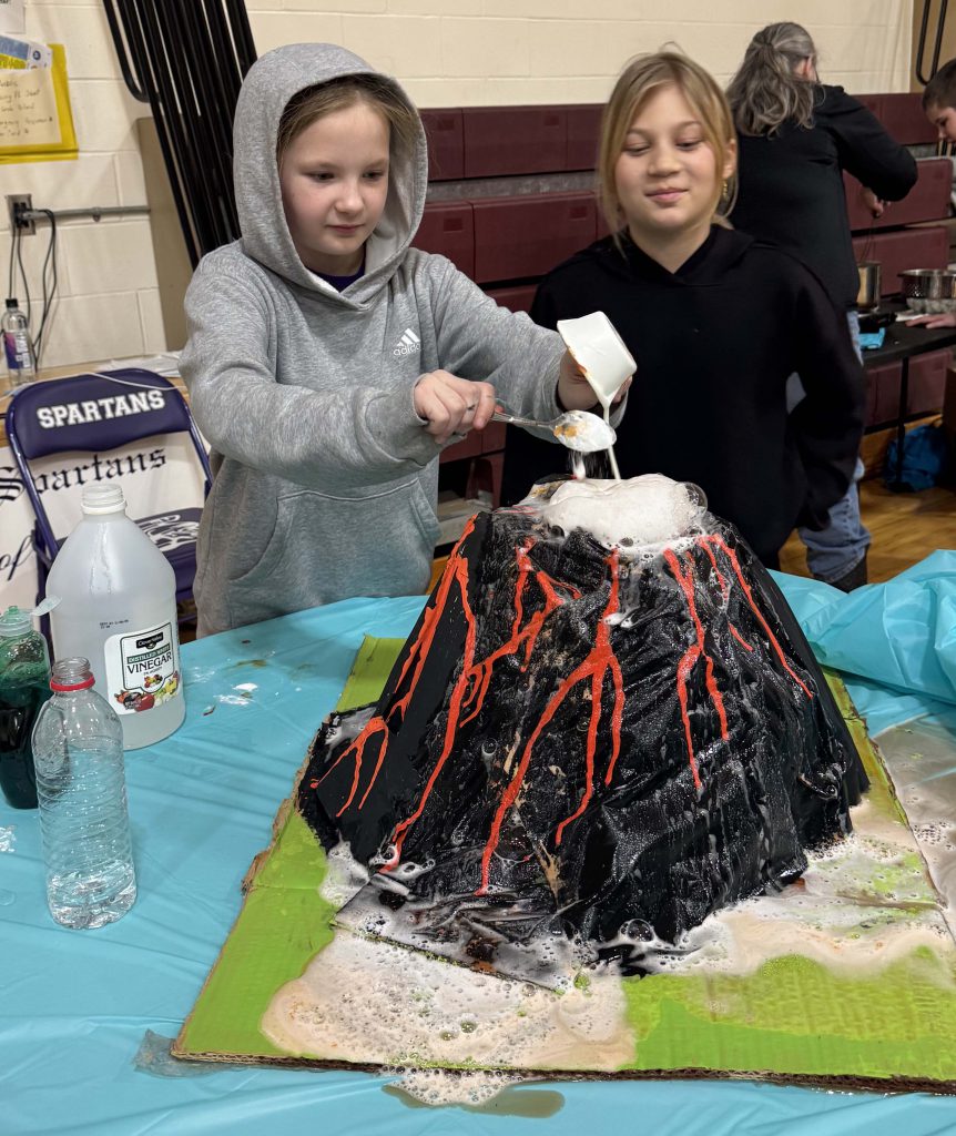 Students make an experiment valcano